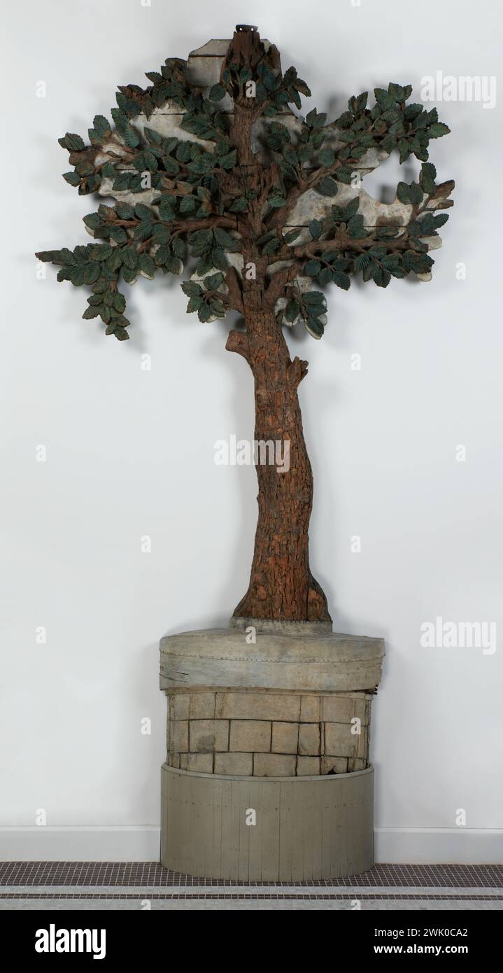 Anonimo, all'orme Saint-Gervais. Marchio di Taillandier - Quincailler. Angolo di rue Longpont - de Brosse e n ° 6. Rue Monceau - Saint - Gervais, quindi, 20. rue du Temple, IV arrondissement, Parigi (titolo fittizio), 1775. Legno scolpito e verniciato (grigio, verde), lamiera (tronco dell'albero). Museo Carnavalet, storia di Parigi. Ornamento, albero, olmo, foglia, margelle, beh, concessionario di attrezzi. Foto Stock