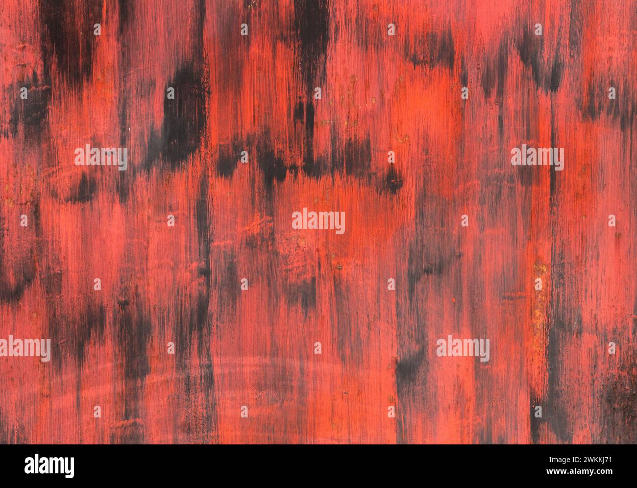 Parete nera con tratti di vernice rossa. Foto Stock