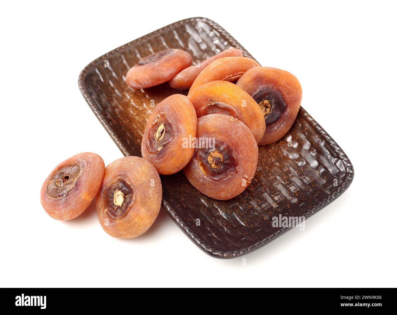 Persimmon essiccato su sfondo bianco Foto Stock