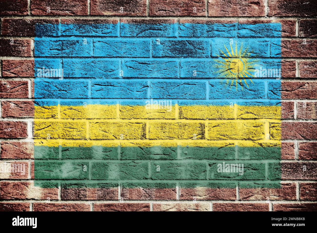 Bandiera del Ruanda sullo sfondo di un vecchio muro di mattoni Foto Stock