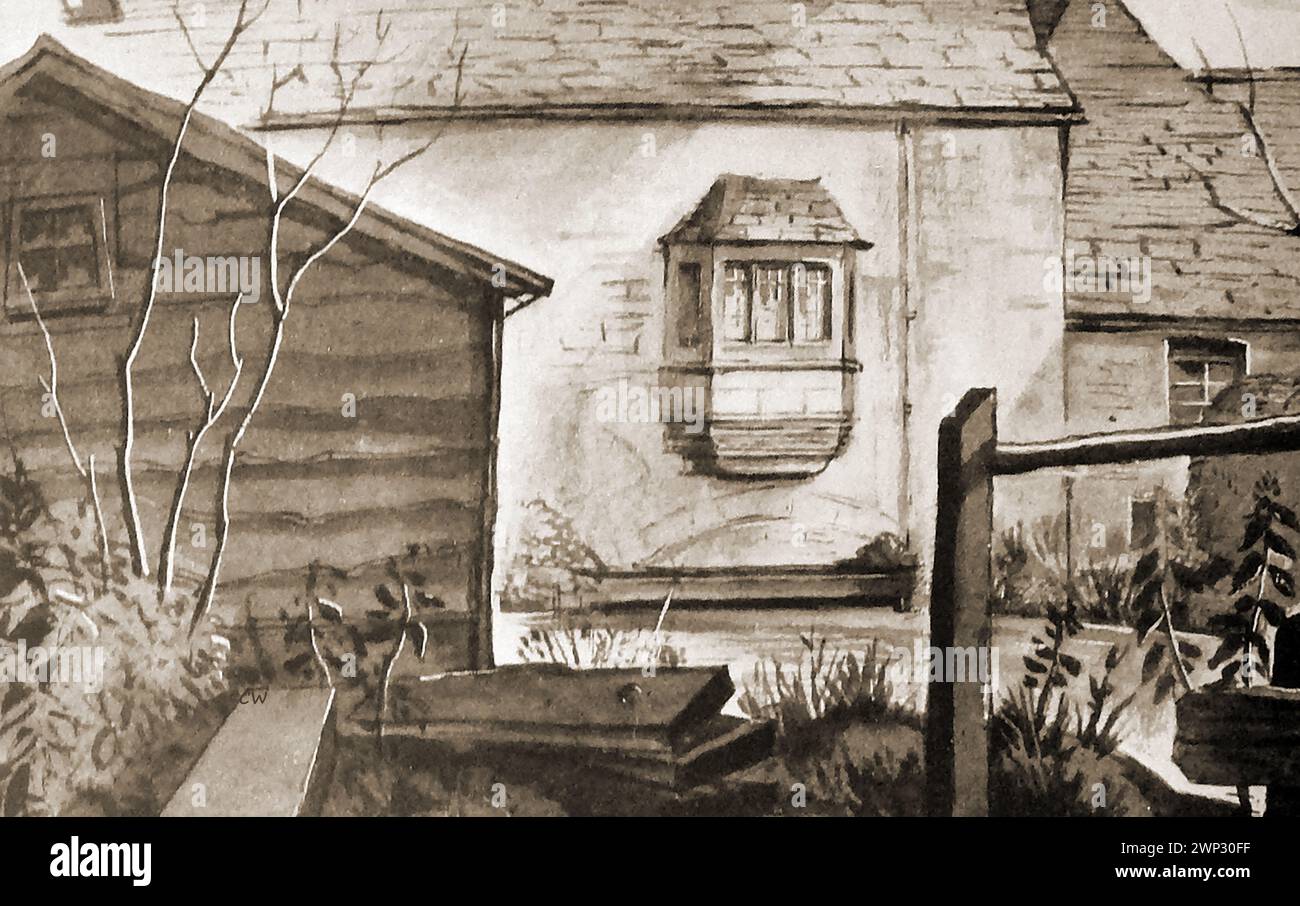 Una scena del 1935 a Whelsford, Cotswold, che mostra un'antica finestra Foto Stock