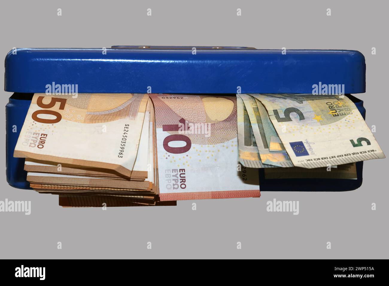 Aufbewahren von Bargeld Geldscheine in einer blauen Geldkassette **** immagazzinamento di banconote in contanti in una cassa blu Foto Stock