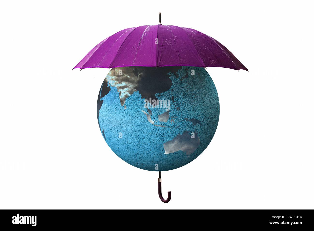 Globo terrestre con Australia e Asia coperti da un ombrello. Concetto di cambiamento climatico. L'ombrello aperto protegge la Terra da pioggia e inondazioni. Foto Stock