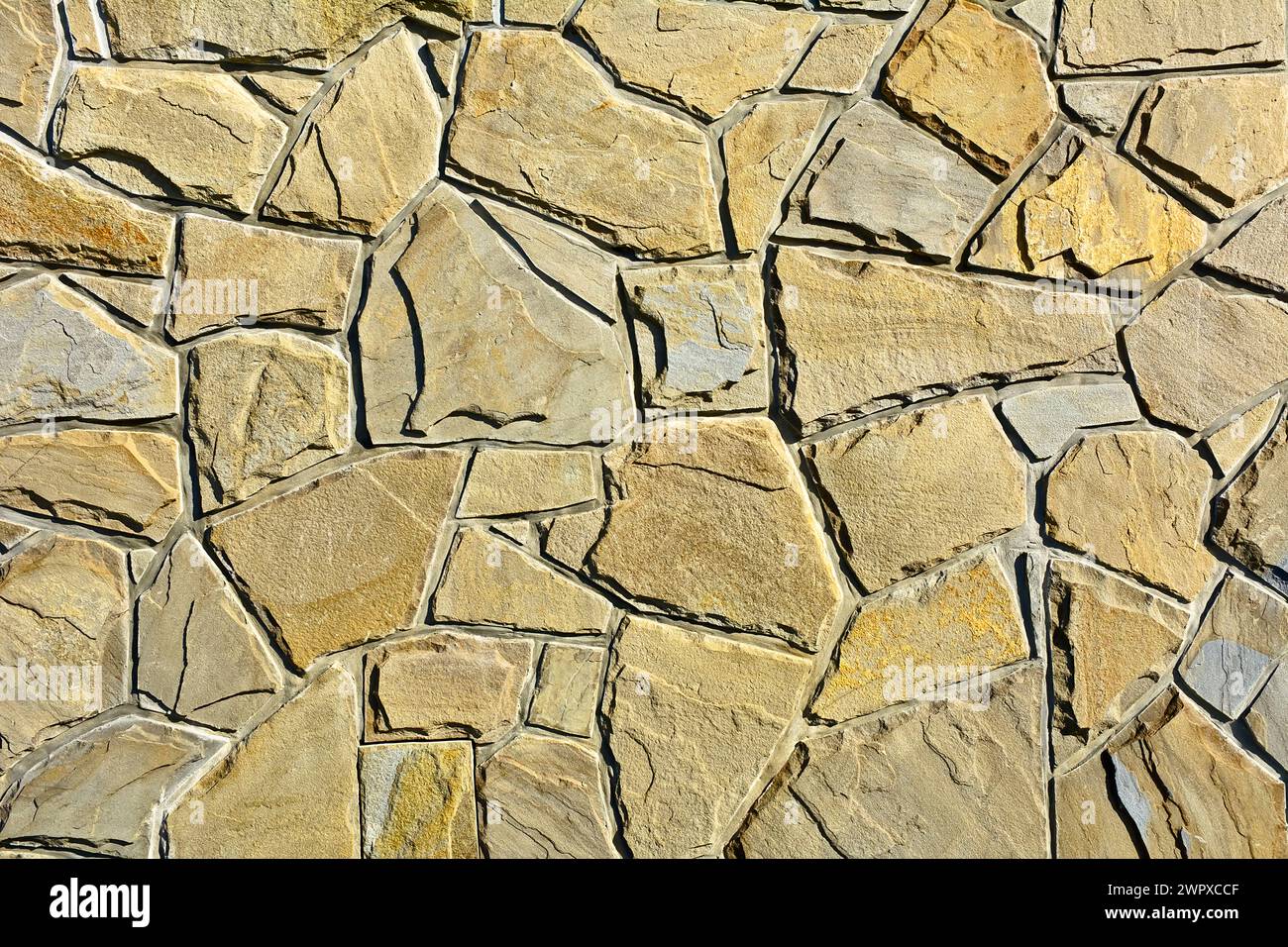Blocchi di pietra beige nel muro Foto Stock