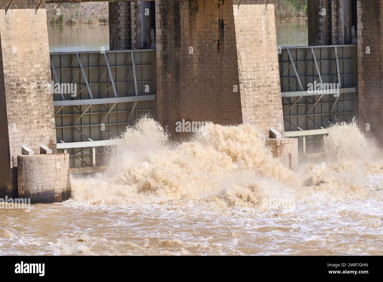 The Alcala del Rio dam releases water after the rains from the passage of the Monica squall on March 11, 2024 in Seville (Andalusia, Spain). The reservoirs of the Guadalquivir basin gain 200 hectometers with the rains of the Monica squall. 08 MARCH 2024 Joaquin Corchero / Europa Press 03/11/2024 (Europa Press via AP) Foto Stock