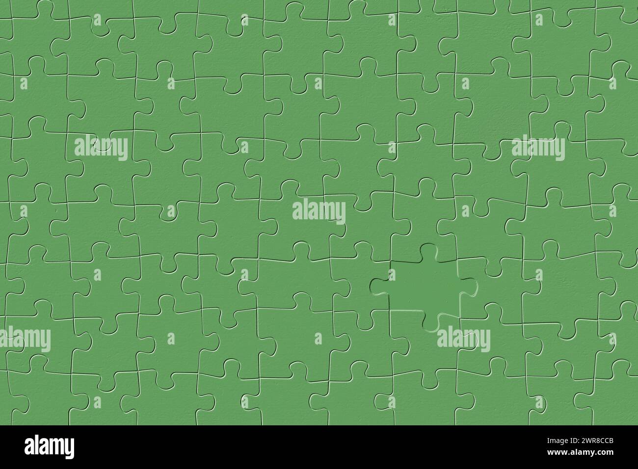 Pezzo mancante in rilievo di un puzzle verde. Foto Stock