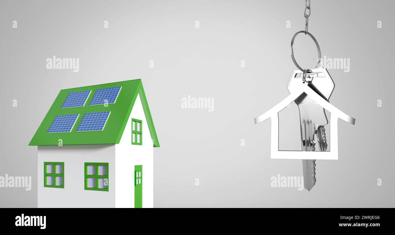 Chiavi di casa argentate con un telecomando a forma di casa sopra un'immagine di casa verde e bianca. Foto Stock