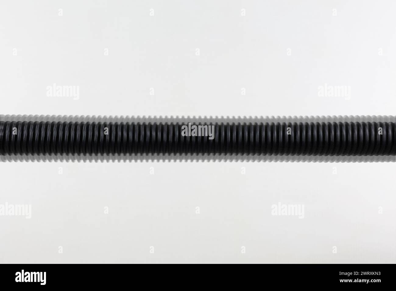 Un'illustrazione di un tubo flessibile a spirale che mostra un design a onda pixel su una sezione orizzontale del tubo flessibile. Foto Stock