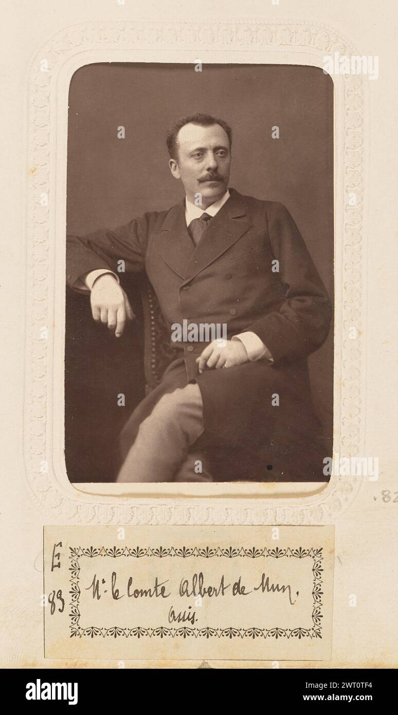 Monsieur le Comte de Mun. Bertall & Cie, fotografo circa 1870–1879 Un ritratto di Adrien Albert Marie, conte di Mun. È seduto con le gambe incrociate e un braccio appoggiato su un tavolino o su un piedistallo. Ha i capelli scuri corti e i baffi. (Recto, monta) parte superiore centrale, testo stampato in nero: 'BERTALL & CIE PHOT.'; parte inferiore centrale, testo stampato in nero: 'ME. LE CTE. DE MUN'; (verso, Mount) centro, marchio del produttore nero: "PHOTOGRAPHIE/BERTALL/& CIE/RUE BOISSY D'ANGLAS.33./Ancienne Rue de la Madeleine."; (Recto, pagina album) centro inferiore, sotto l'immagine, inchiostro nero su etichetta di carta bianca: "E/83 [spazio] M. Foto Stock