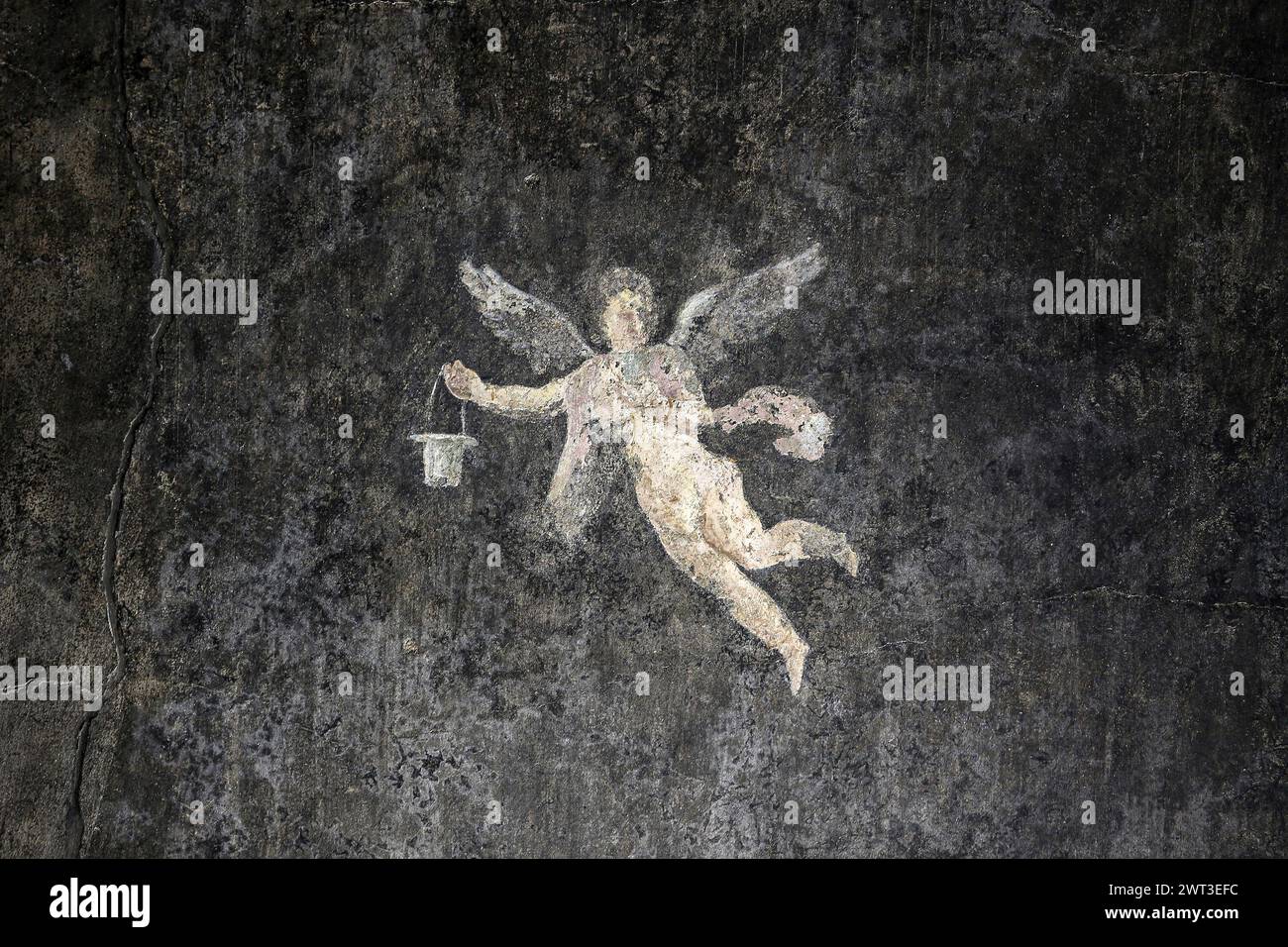 Un dettaglio di uno degli affreschi nella restaurata casa del frutteto, situata negli scavi archeologici di Pompei. Foto Stock