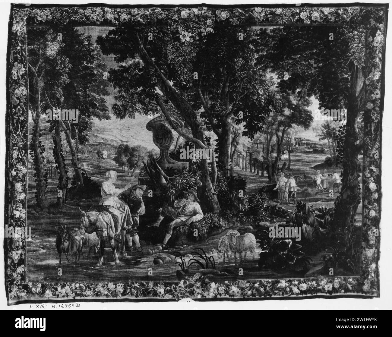 Scena paesaggistica. Teniers, Davide II (fiammingo, 1610-1690) (disegnato dopo, attr., paesaggio) [pittore] Teniers, David III (fiammingo, 1638-1685) (disegnato dopo, attr., paesaggio) [pittore] Coppens, Augustin (fiammingo, 1668-1740) (disegnato dopo, attr., figure) [pittore] c. 1700-1720 arazzi dimensioni: h 11' x W 15' arazzi materiali/tecniche: sconosciuta Cultura: Flemish Weaving Center: Bruxelles storia di proprietà: French & Co.. In un ambiente boscoso, figure che fumano, cavalcano, conversano e trattano pecore vicino a grandi urne scolpite (BRD) ghirlanda di fiori; (L BRD) corona e spade al centro; (R BRD) qu Foto Stock