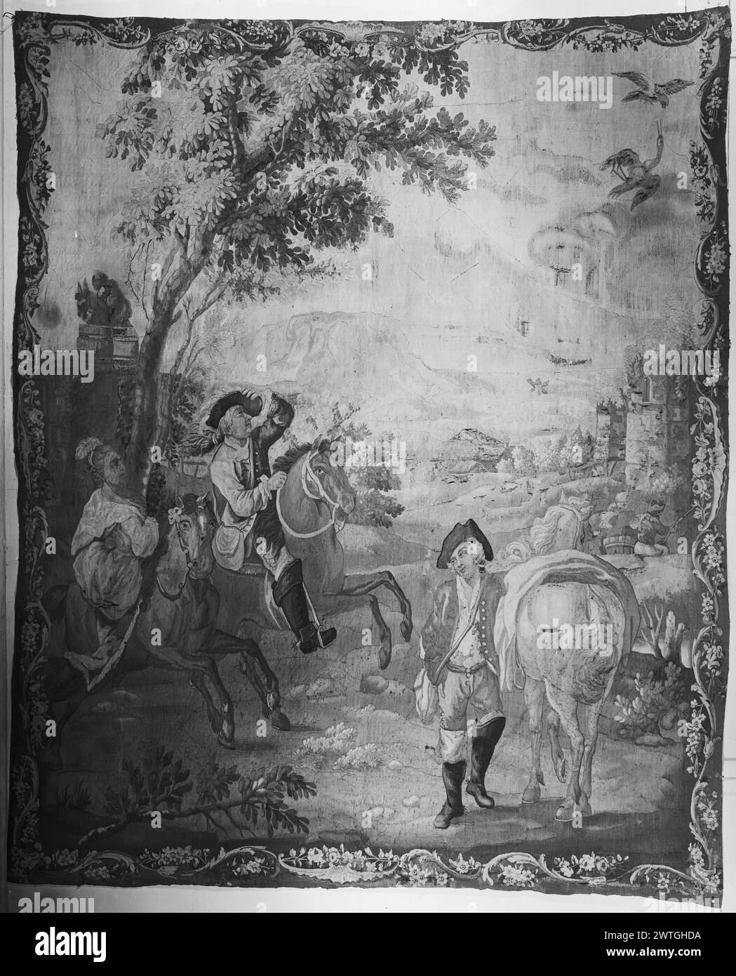 Falconieri che vanno a caccia. Sconosciuto c. 1770-1790 arazzi dimensioni: H 7' x W 5'7' arazzo materiali/tecniche: Sconosciuto Cultura: Francese tessitura Centro: Aubusson storia di proprietà: French & Co. Ricevuto dalla signora Philip Wilson 7/22/1948; restituito il 21/2/1958. In un paesaggio con alberi ed edifici, Lady & gentleman montato su cavalli che guardano gli uccelli attaccati dal falco, mentre lo sposo frequenta un cavallo sul fianco; fisherman in background (R), edifici aggiuntivi e mulino a vento in lontananza (BRD) all'interno di una cornice smerlata e giardinata con foglie di acanto e fiori i fogli di scorta menzionano le "cattive condizioni" di Th Foto Stock