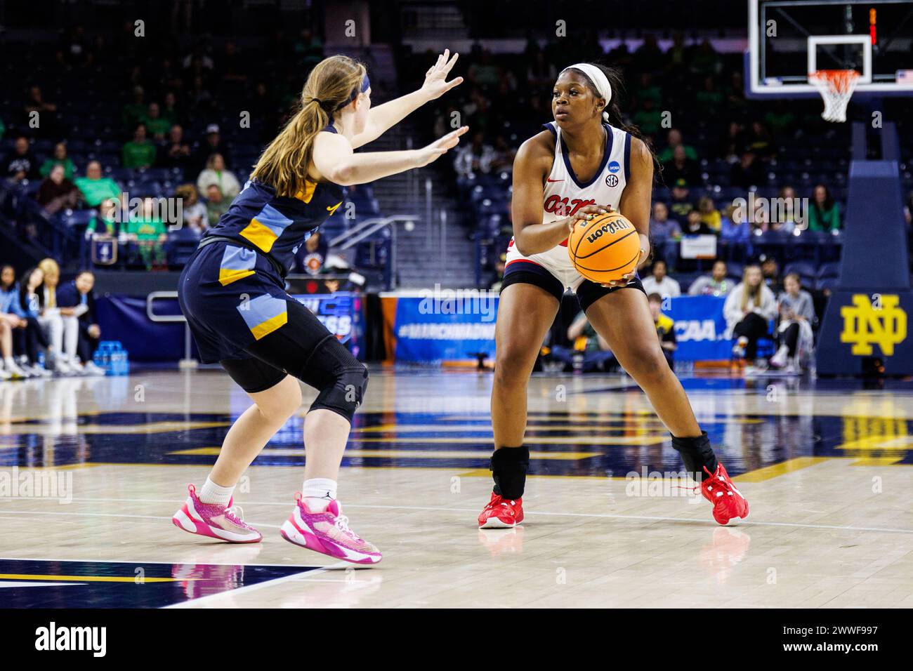 South Bend, Indiana, Stati Uniti. 23 marzo 2024. L'attaccante del Mississippi Kharyssa Richardson (33) sembra passare la palla mentre la guardia di Marquette Claire Kaifes (10) difende durante la partita di basket NCAA Women's Tournament First Round tra i Marquette Golden Eagles e i Mississippi Rebels al Purcell Pavilion al Joyce Center di South Bend, Indiana. John Mersits/CSM/Alamy Live News Foto Stock