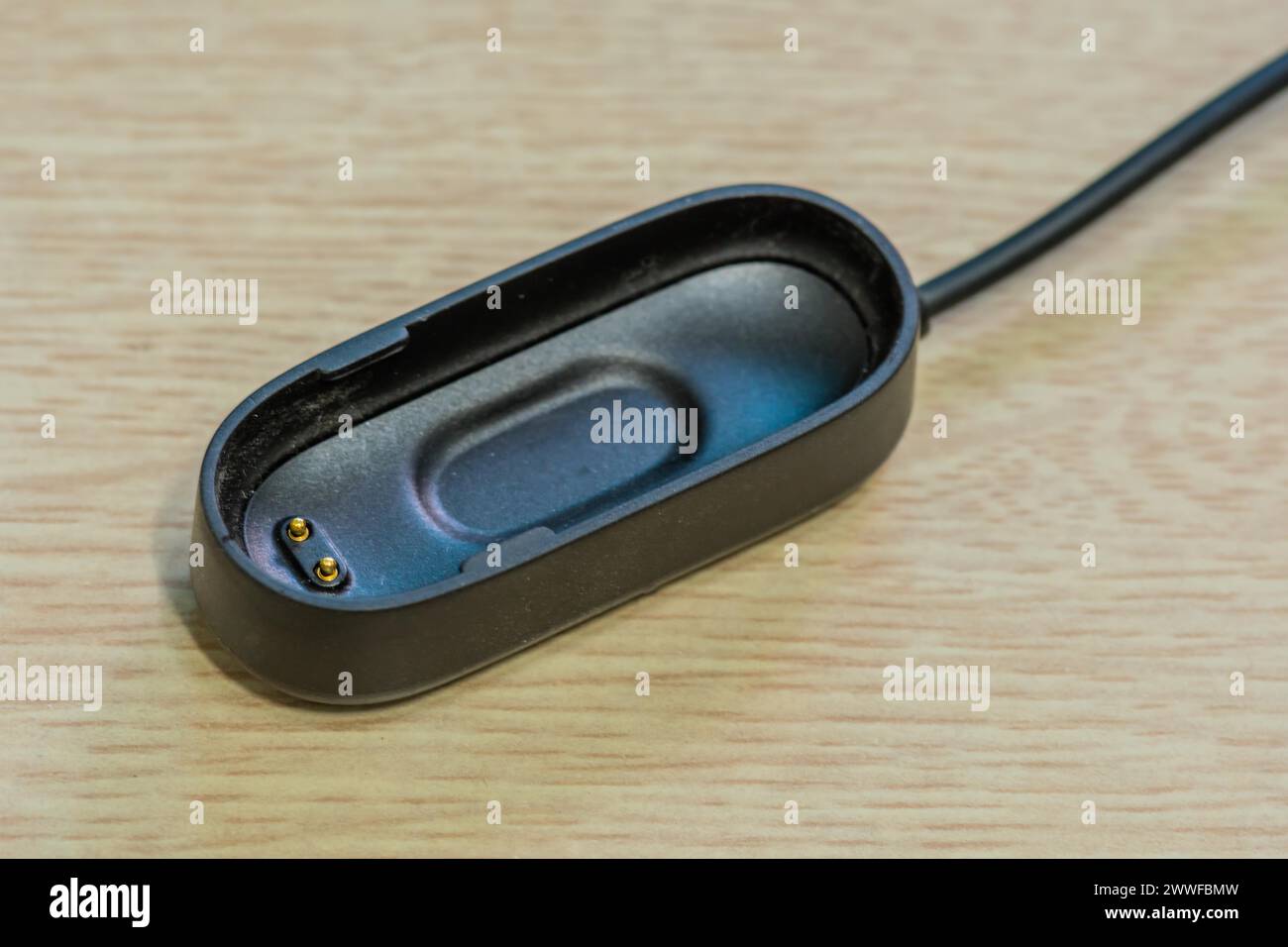 Primo piano della base docking di ricarica per piccoli dispositivi elettronici Foto Stock