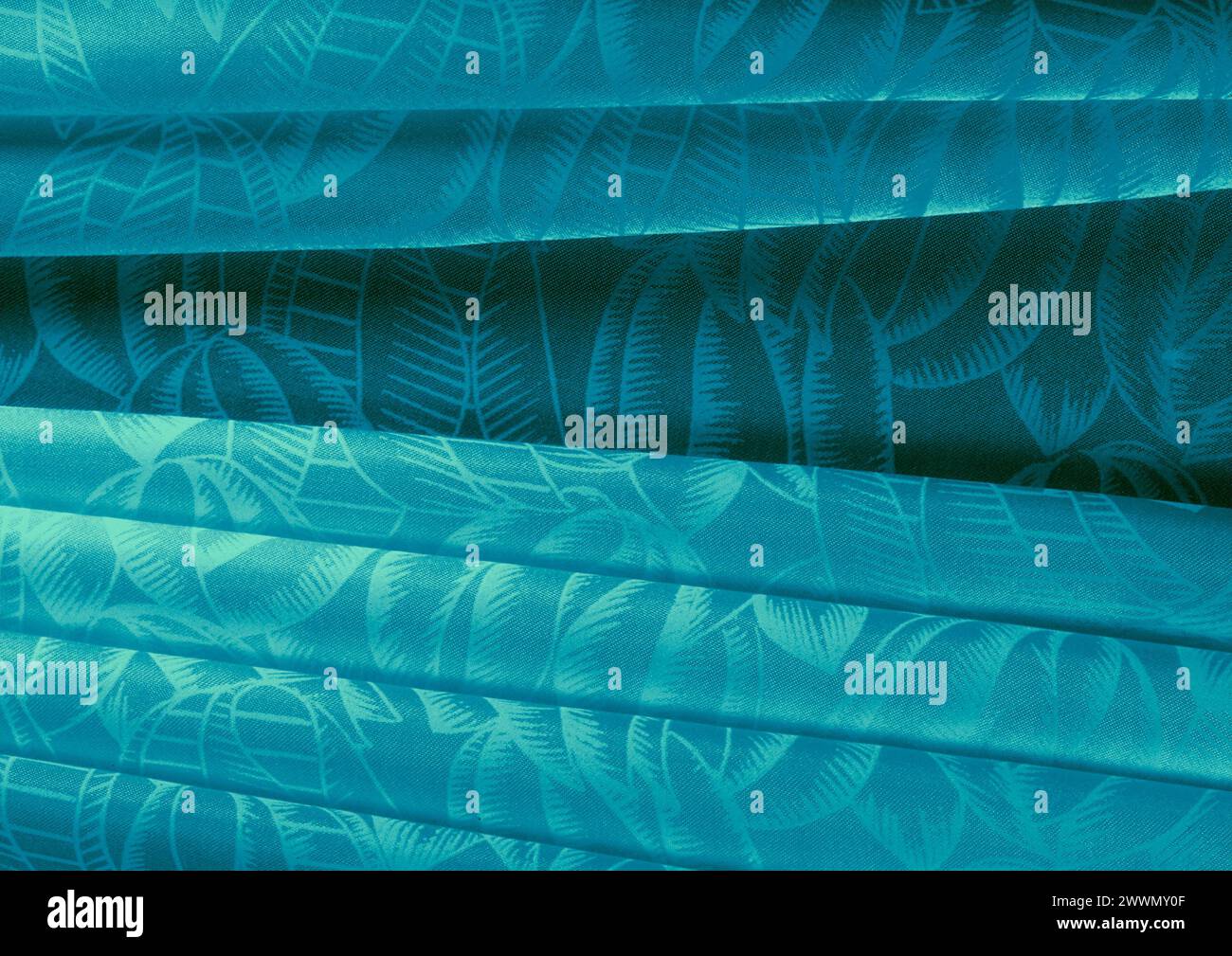 Vista ravvicinata con motivo in tessuto verde, sfondo del materiale tessile Foto Stock