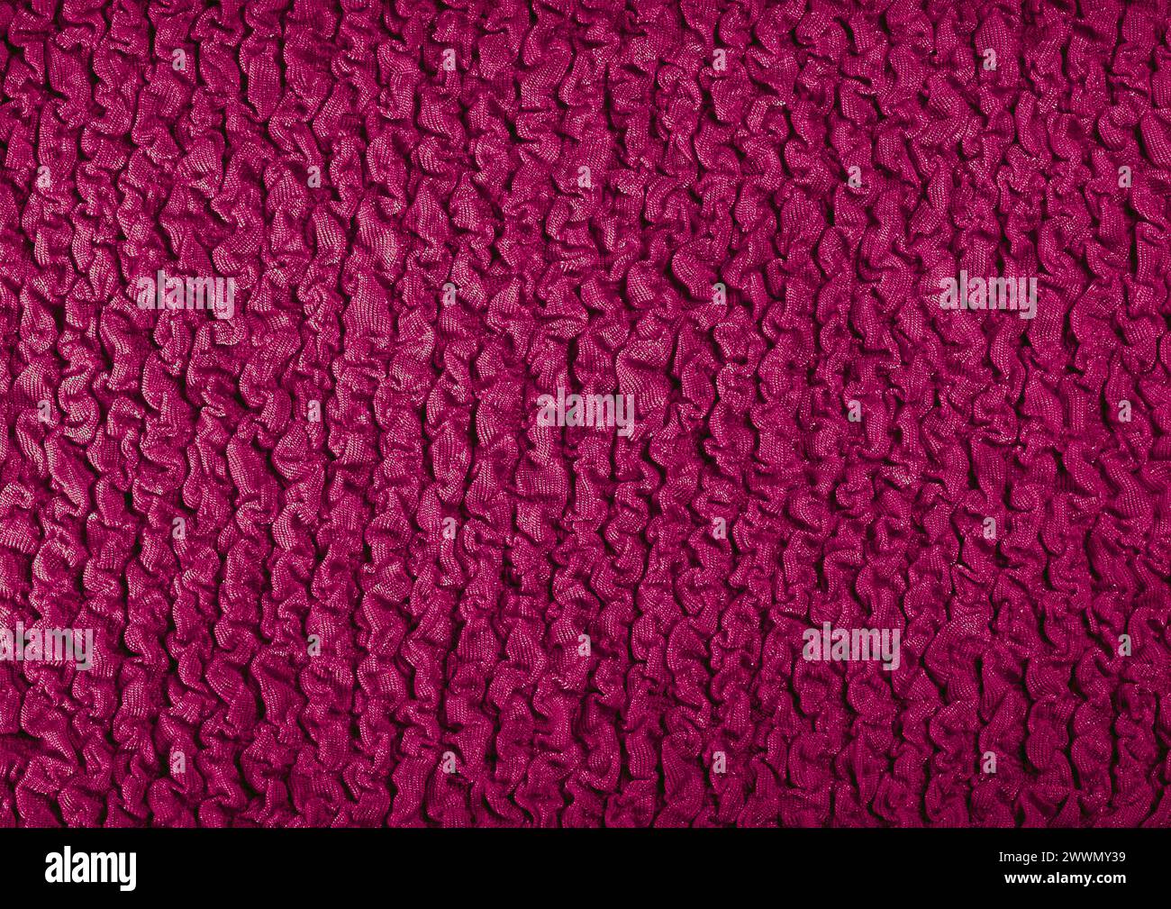 Vista ravvicinata con motivo in tessuto rosso, sfondo del materiale tessile Foto Stock