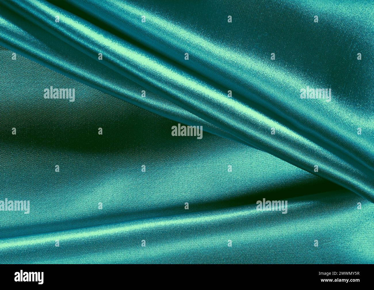 Vista ravvicinata con motivo in tessuto verde, sfondo del materiale tessile Foto Stock