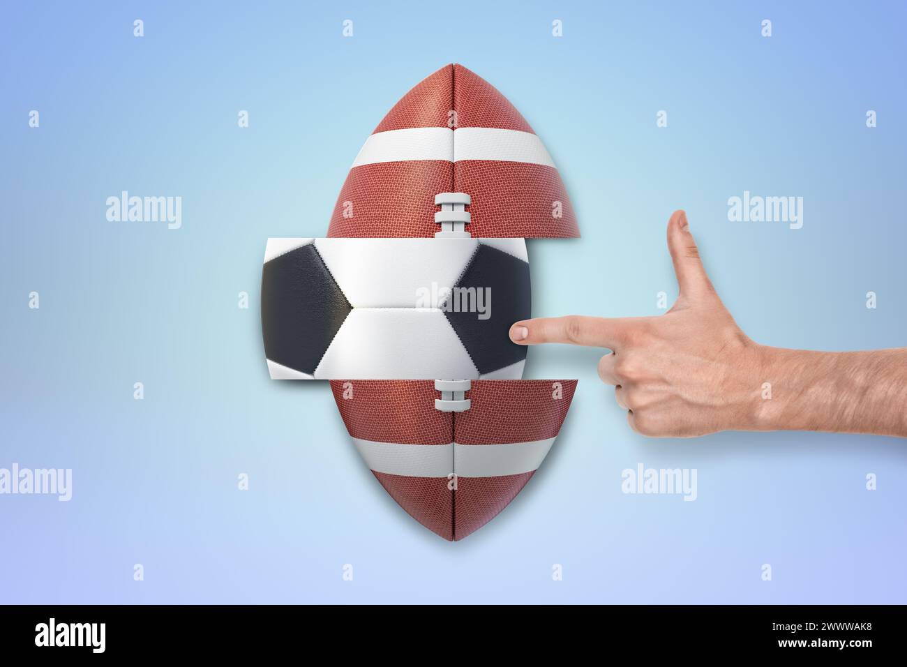 Puntare il dito verso un pallone da football americano Foto Stock