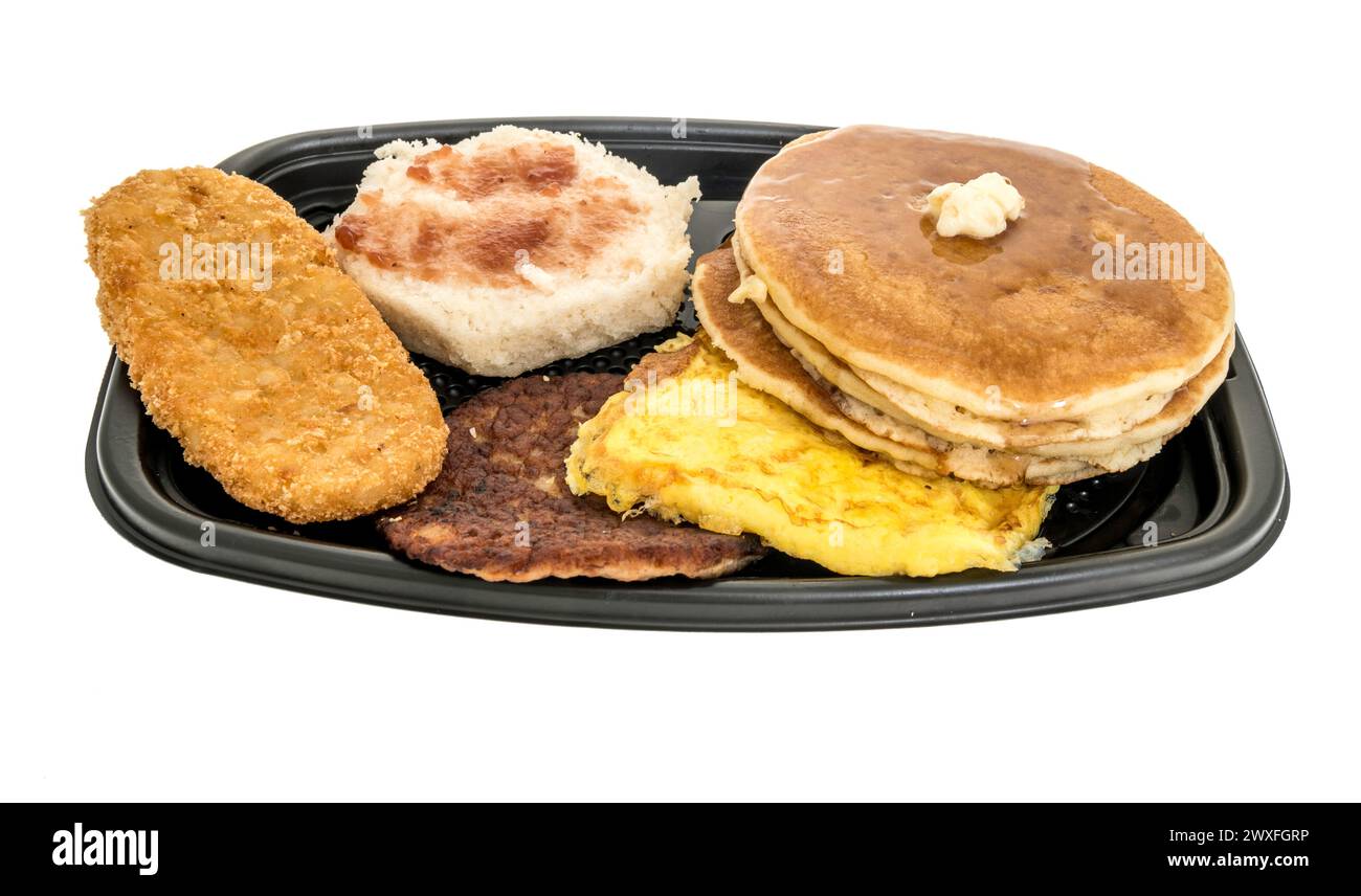 Winneconne, WISCONSIN - 30 marzo 2024: Un pacchetto di colazione McDonalds Big con torte, biscotti, hash Brown, salsiccia, colazione con uova strapazzate su un isolato Foto Stock