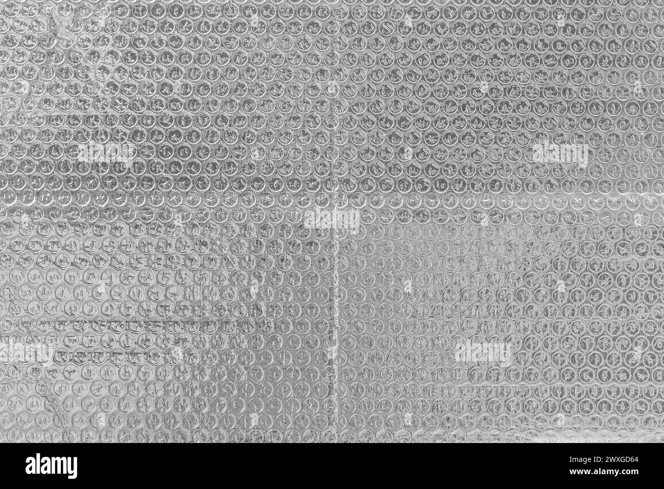 Pellicola trasparente a bolle d'aria di colore argento struttura leggera per imballo di fondo. Foto Stock