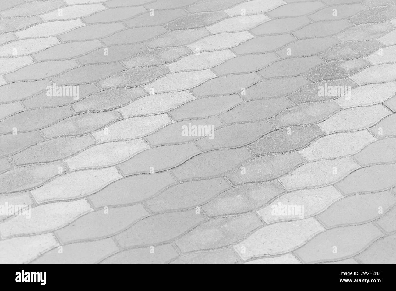 Righe con motivo bianco chiaro strisce pavimentazione in pietra superficie strada strada città piastrelle di sfondo. Foto Stock