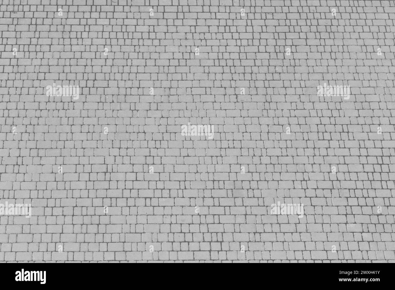 Pavimentazione in pietra grigia pavimento piastrelle City Road superficie superficie astratta sfondo texture. Foto Stock