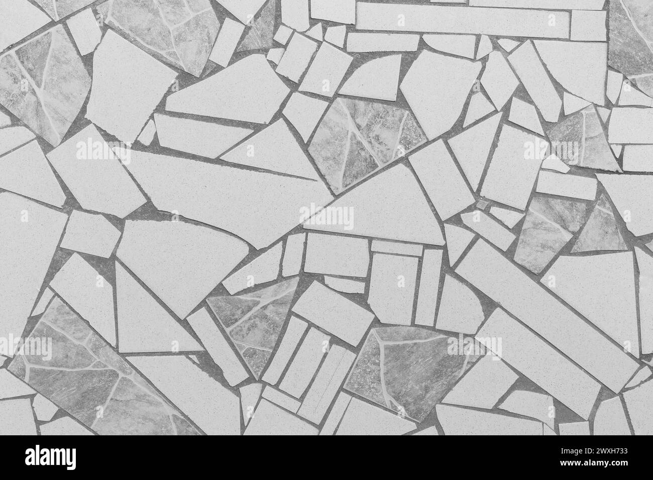 Mattonelle grigie motivo a mosaico astratto Street Road texture City sfondo grigio. Foto Stock