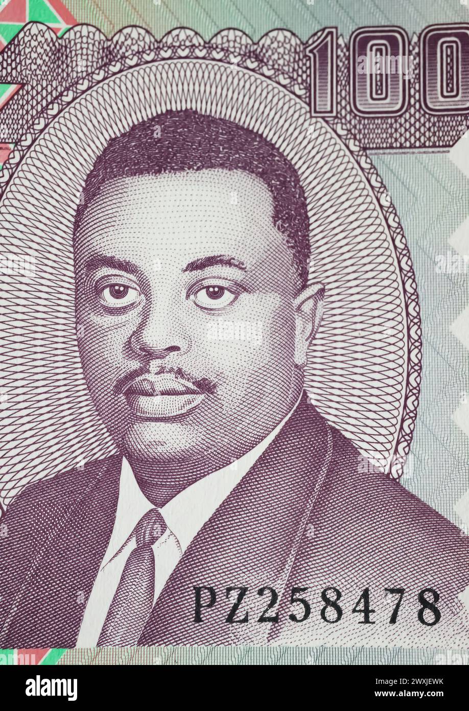 Ritratto del principe Ganwa Louis Rwagasore sulla banconota da 100 franchi del Burundi (focalizzazione sul centro) Foto Stock