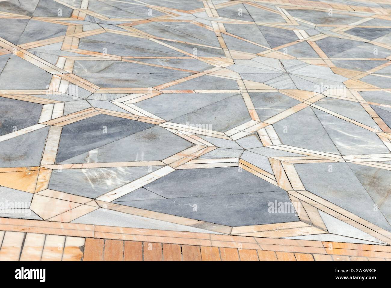 Pavimento in mosaico in pietra con motivo geometrico arabo, texture per foto di sfondo Foto Stock