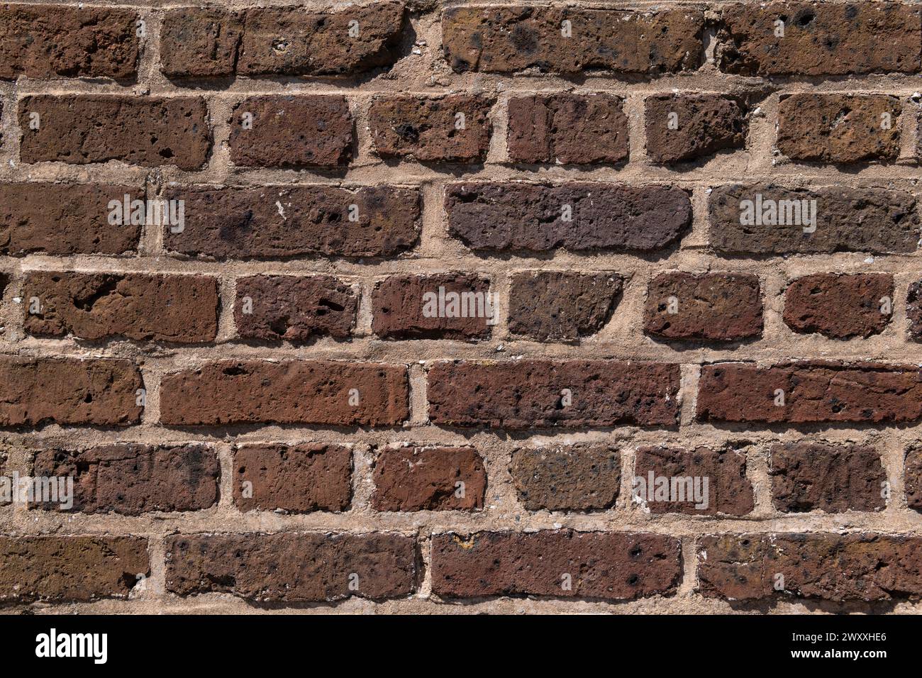 Struttura di fondo di un muro di mattoni molto vecchio. Foto Stock