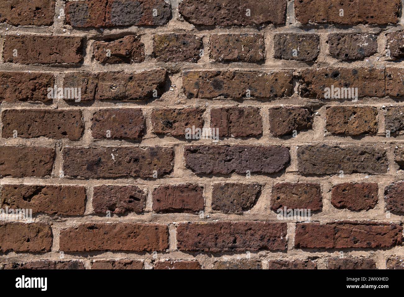 Struttura di fondo di un muro di mattoni molto vecchio. Foto Stock