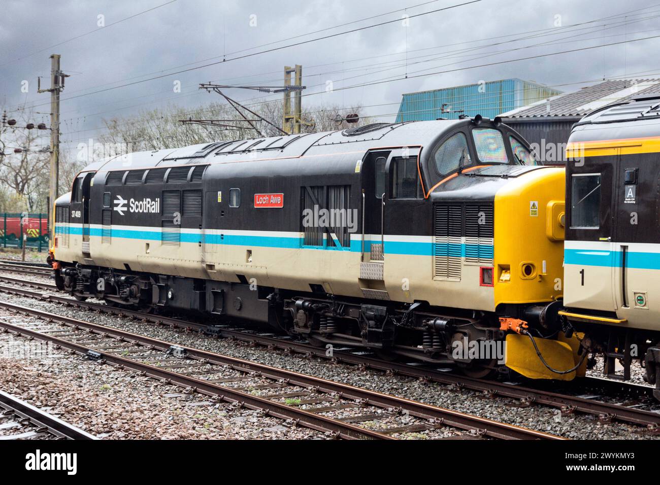 37409 "Loch Awe" sulla linea di down Goods a Preston, in direzione del 5Z37 0643 Crewe H.S. fino al Tom Na Faire Depot, con 37667 in testa. Foto Stock
