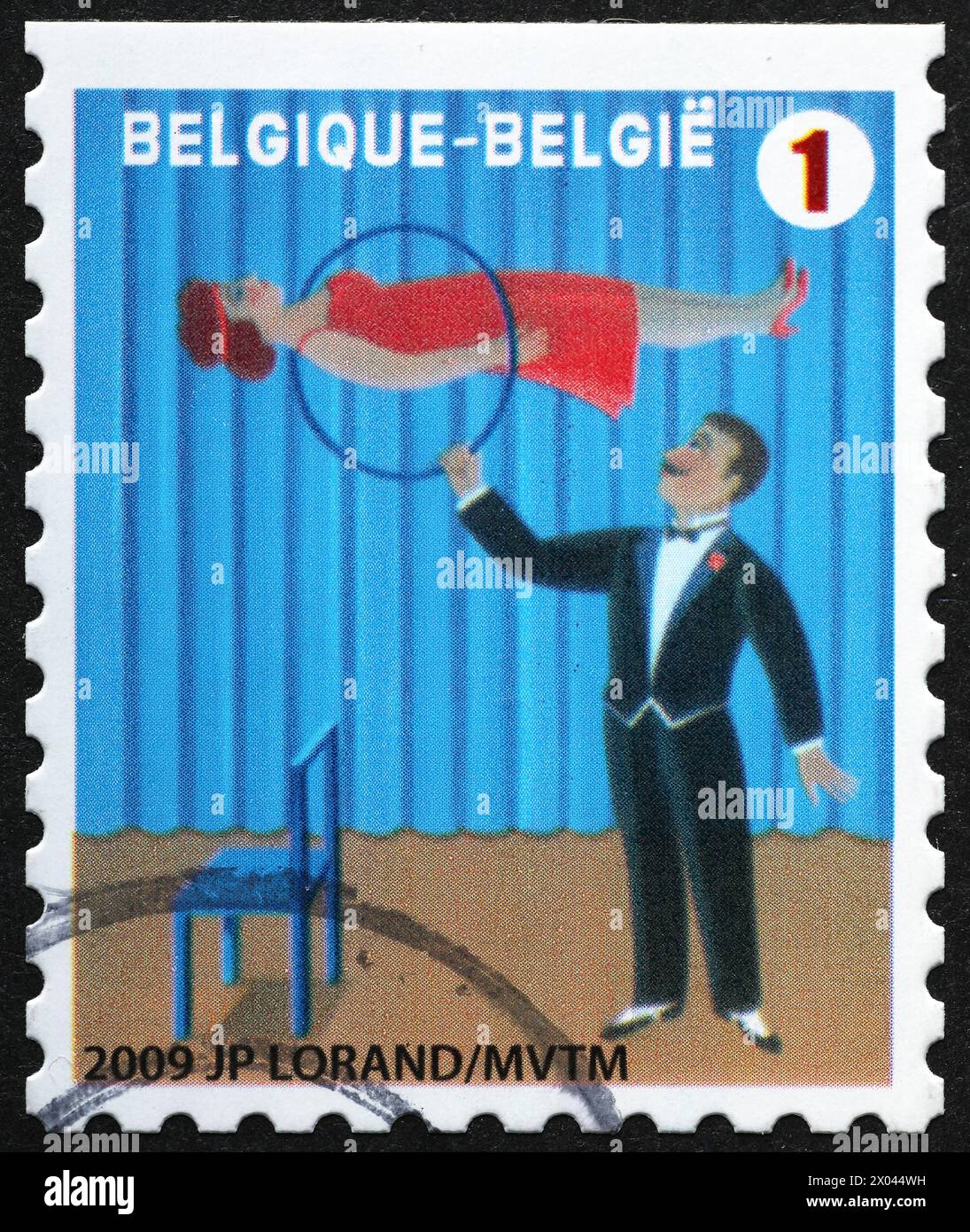 Mago in un circo su un francobollo belga Foto Stock