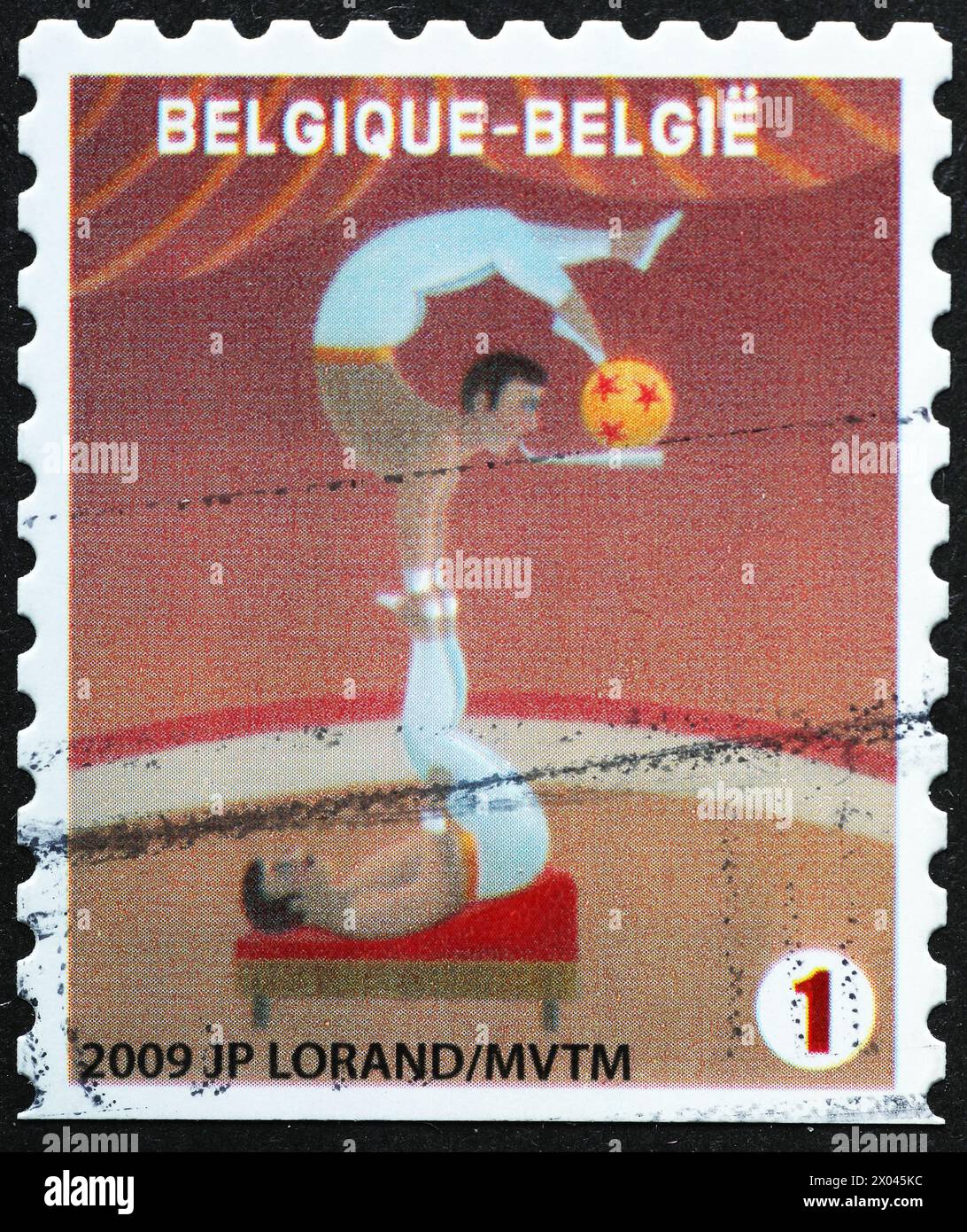 Acrobati in un circo su un francobollo belga Foto Stock