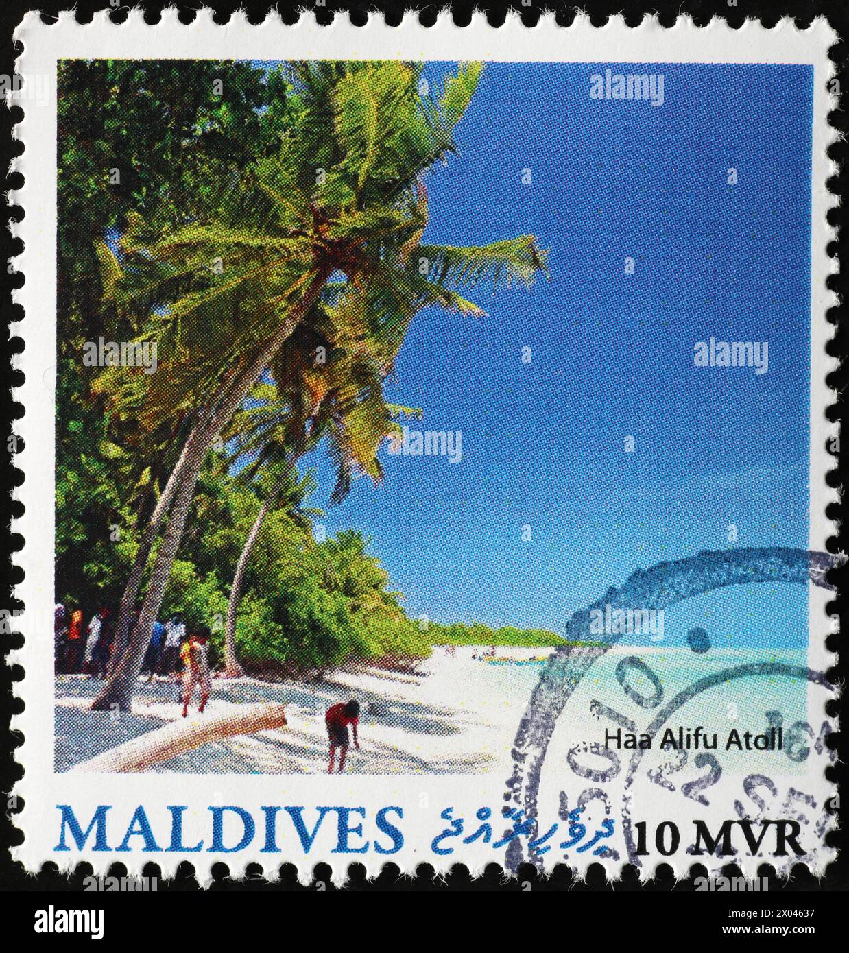 Spiaggia di Corallo alle Maldive su francobollo Foto Stock