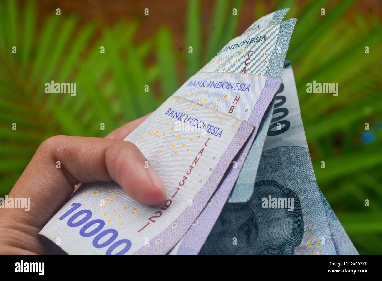 Banconote e monete dall'Indonesia Foto Stock