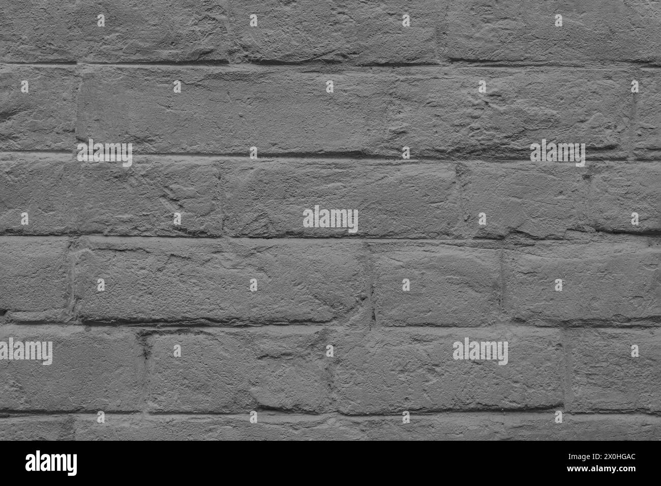 Muratura astratta con agenti atmosferici, texture invecchiata. Vecchio sfondo in mattoni dipinti in grigio stucco macchiato, blocchi di mattoni arrugginiti e grintosi. Sfondo Foto Stock