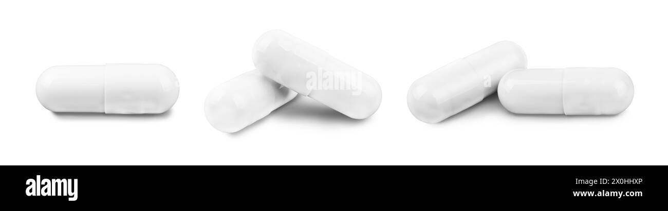 Set di capsule di pillole bianche in diverse posizioni isolate su sfondo bianco. Antibiotici, integratore, vitamina, concetto di assistenza sanitaria, Pharmac Foto Stock
