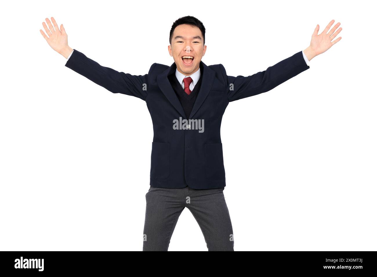 Un giovane uomo d'affari asiatico, un liceale o uno studente universitario sta posando con le braccia che sventolano e sventolano e sorridono alla telecamera. Lui è Weari Foto Stock