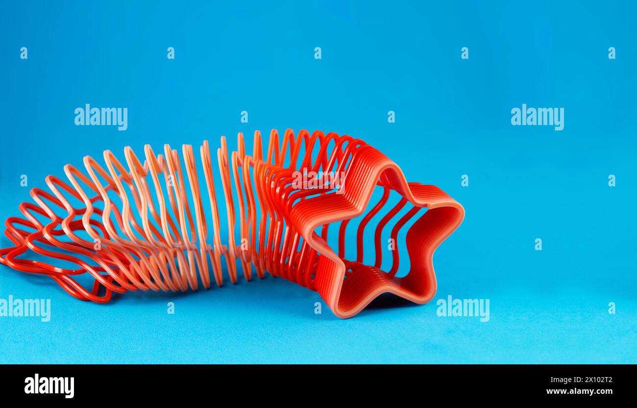 Molla in plastica colorata a forma di stella Foto Stock