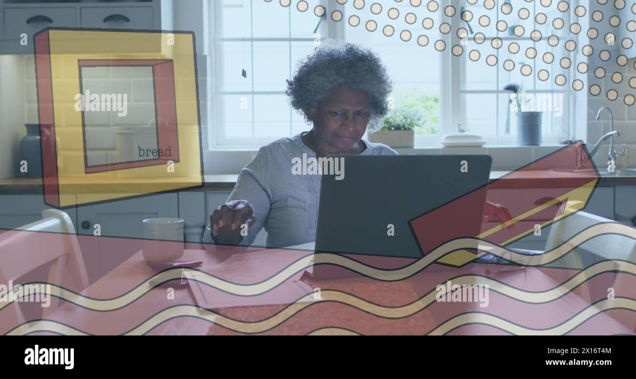 Immagine di forme su una donna afroamericana anziana che usa un computer portatile Foto Stock