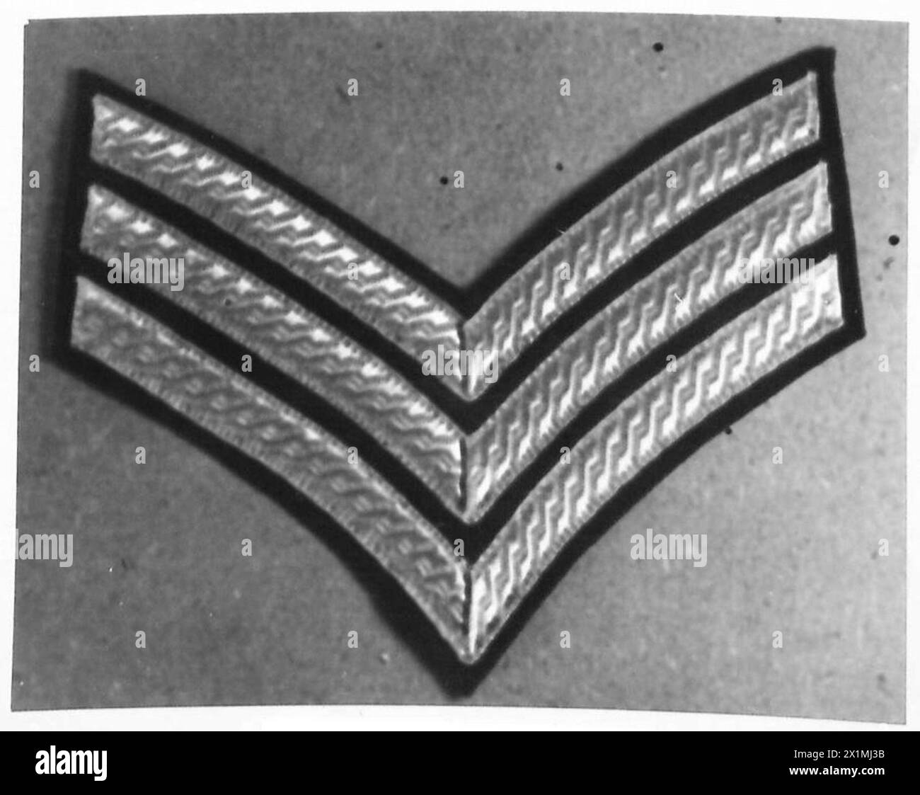 Un Warrant Officer Class III dell'esercito britannico espone distintivi di rango indossati dai sottufficiali. Foto Stock