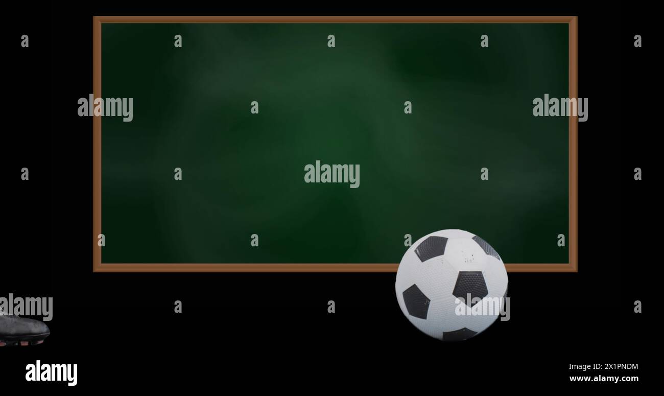 Un pallone da calcio che riposa vicino ai piedi, pronto per un calcio Foto Stock