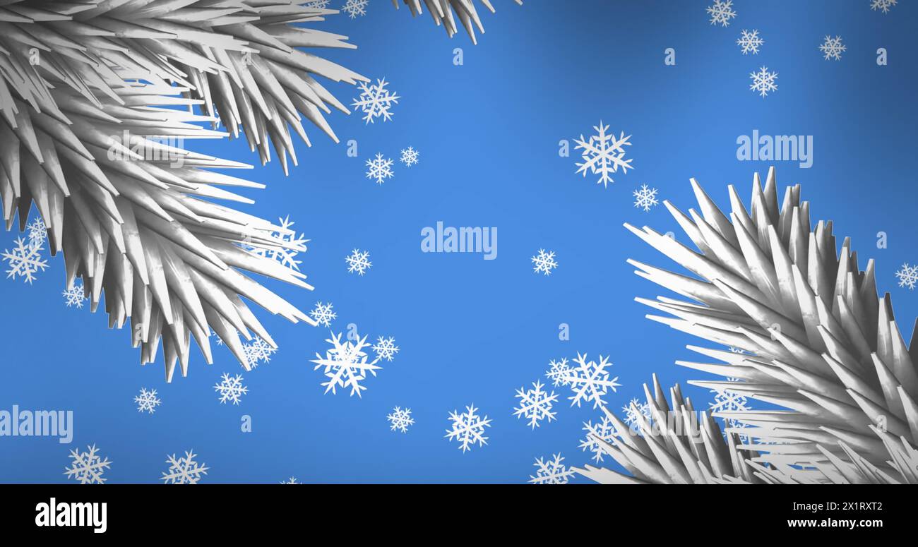 I fiocchi di neve cadono delicatamente su sfondo blu Foto Stock