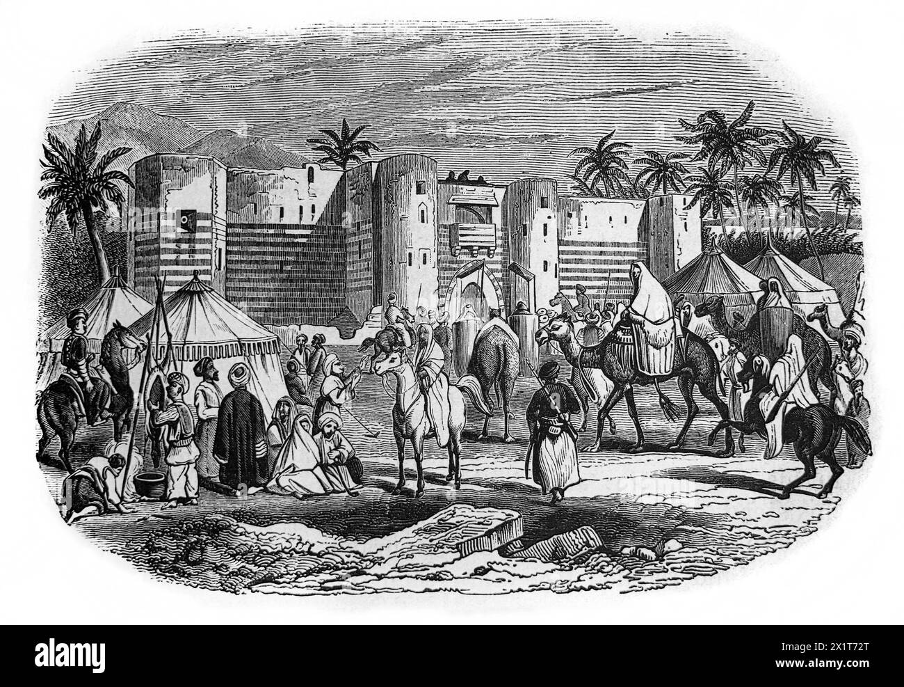 Incisione in legno della Fortezza di Aqaba con l'arrivo di una carovana di pellegrini sulla via del pellegrinaggio per la Mecca dal Famil illustrato del XIX secolo Foto Stock