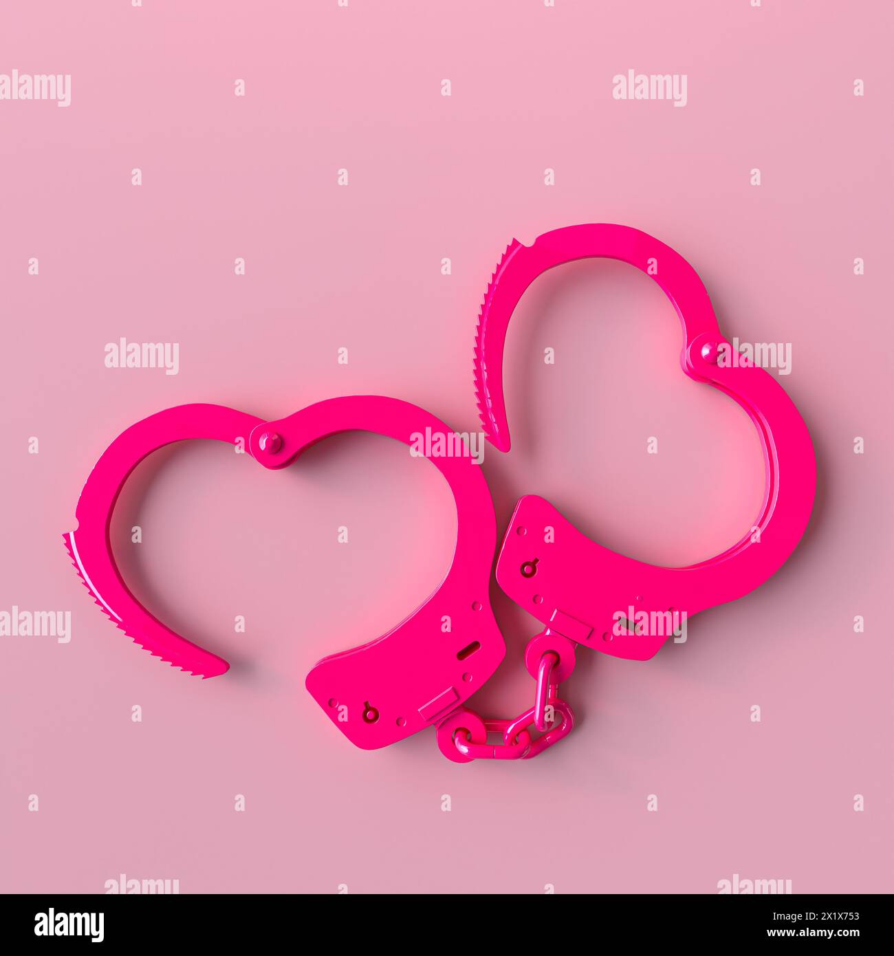Un paio di polsini rosa brillante forma un cuore su uno sfondo rosa tenue Foto Stock