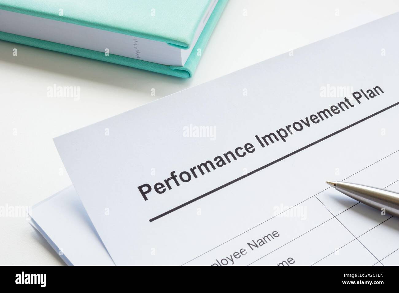 Documenti sul piano di miglioramento delle prestazioni e sulla penna. Foto Stock