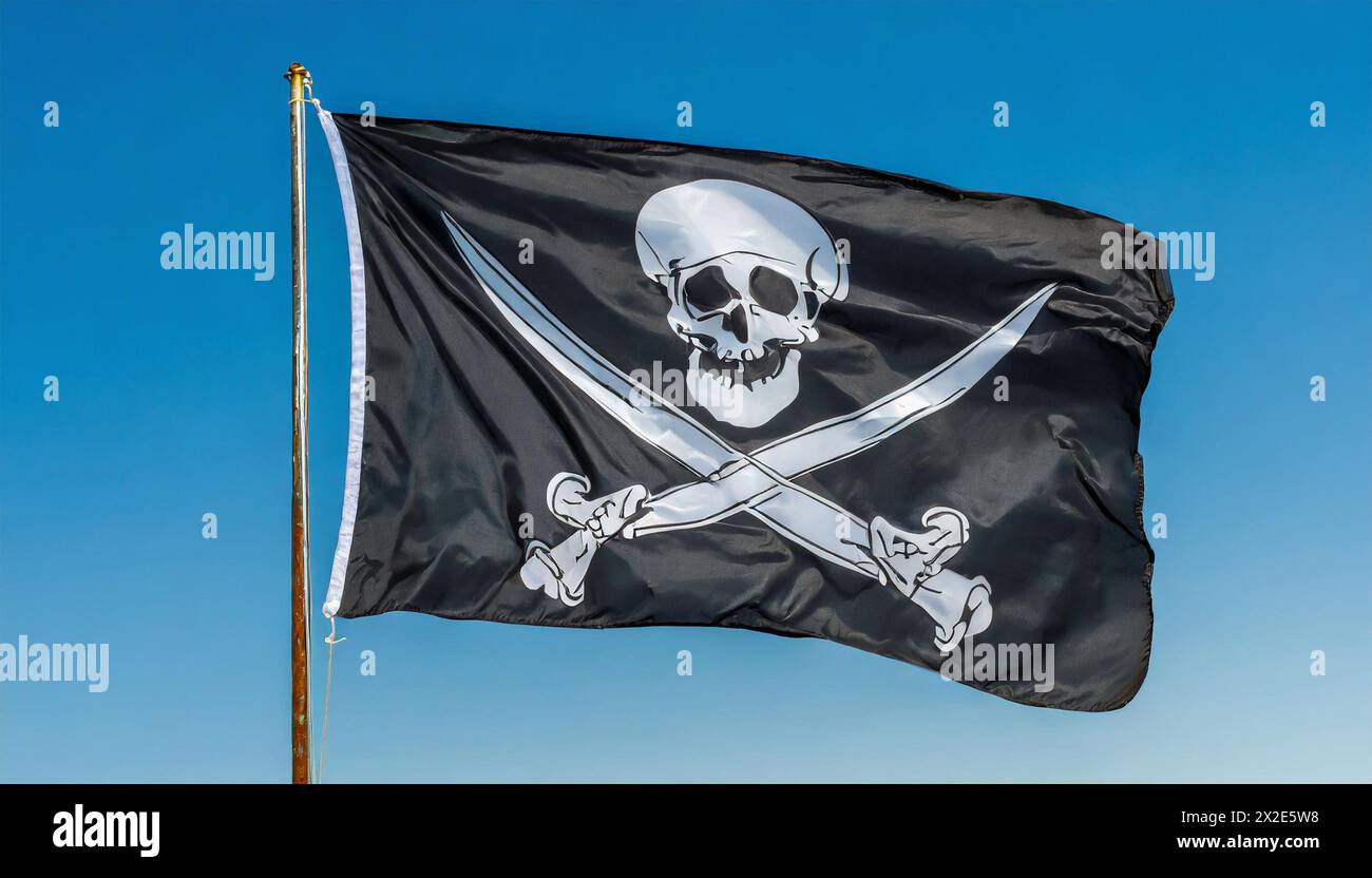 Die Piratenflagge flattert im Wind, isoliert, gegen den blauen Himm Foto Stock