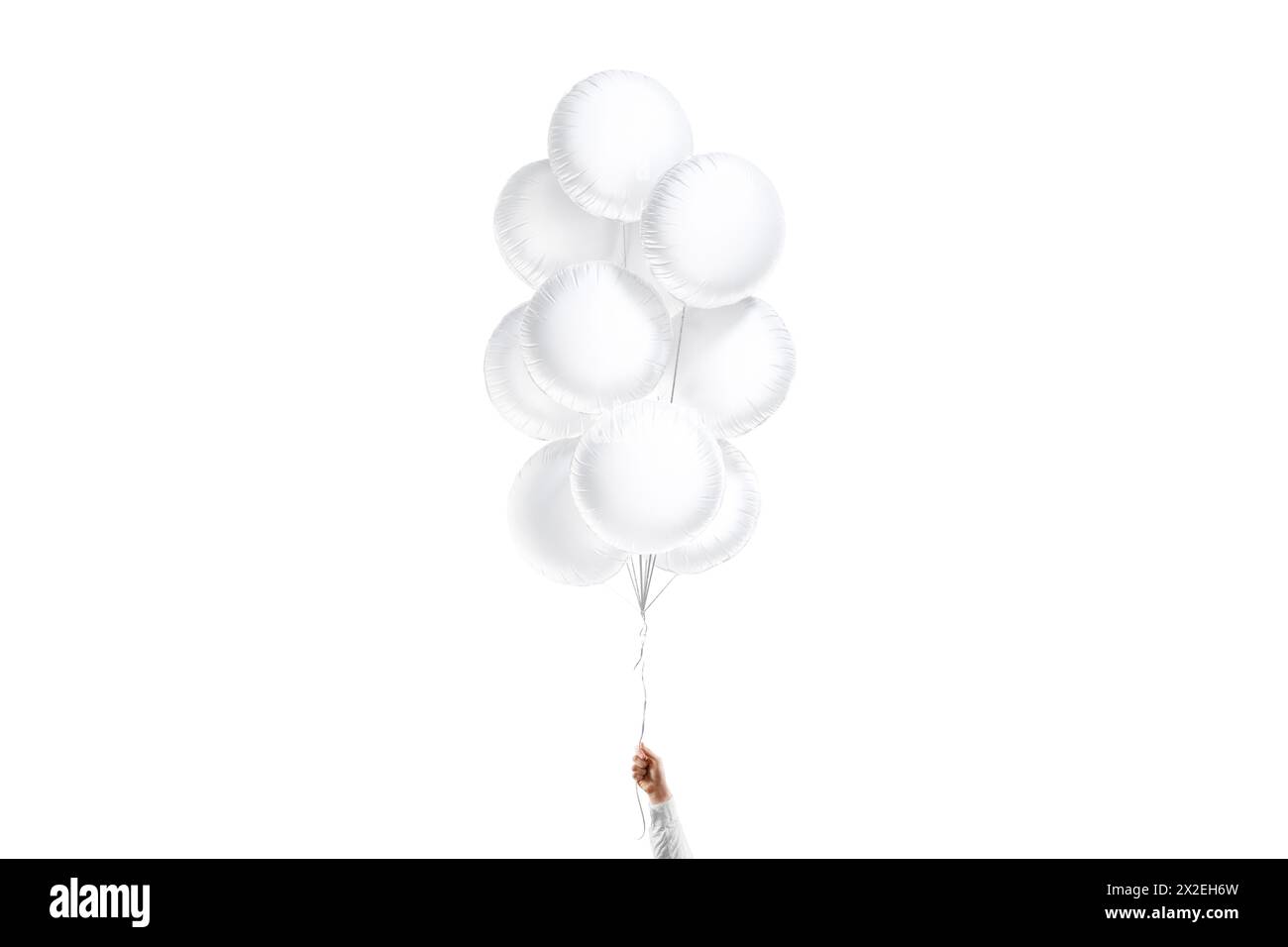 Mano che tiene il mockup bianco rotondo con palloncini, isolato Foto Stock