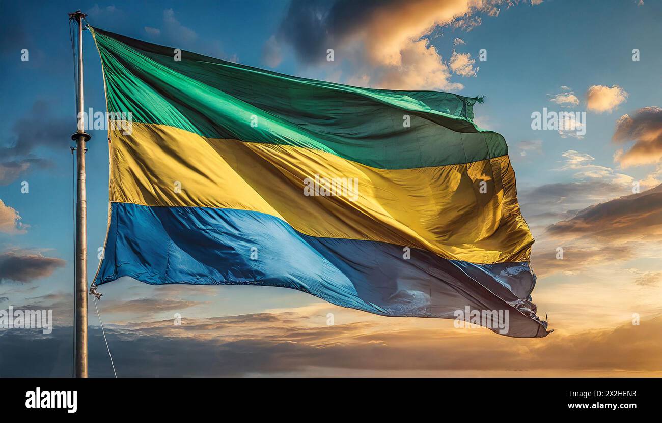 Die Fahne von Gabun flattert im Wind, isoliert gegen blauer Himmel Foto Stock